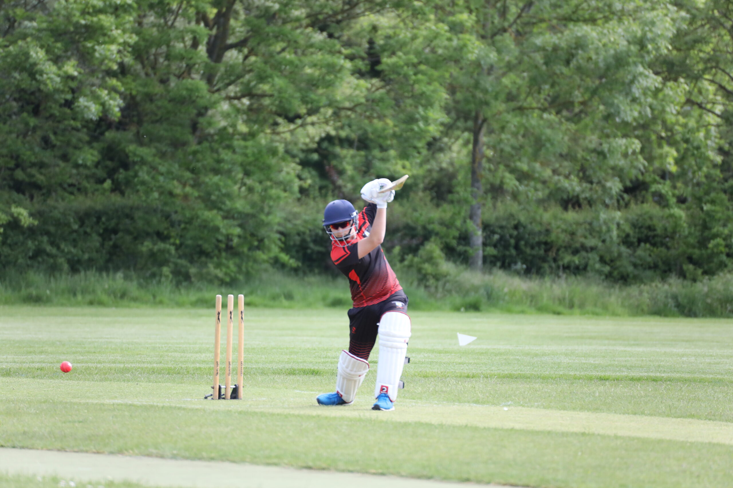 Josh Hatcher of Guildford City Cricket Youth Project playing a cover drive